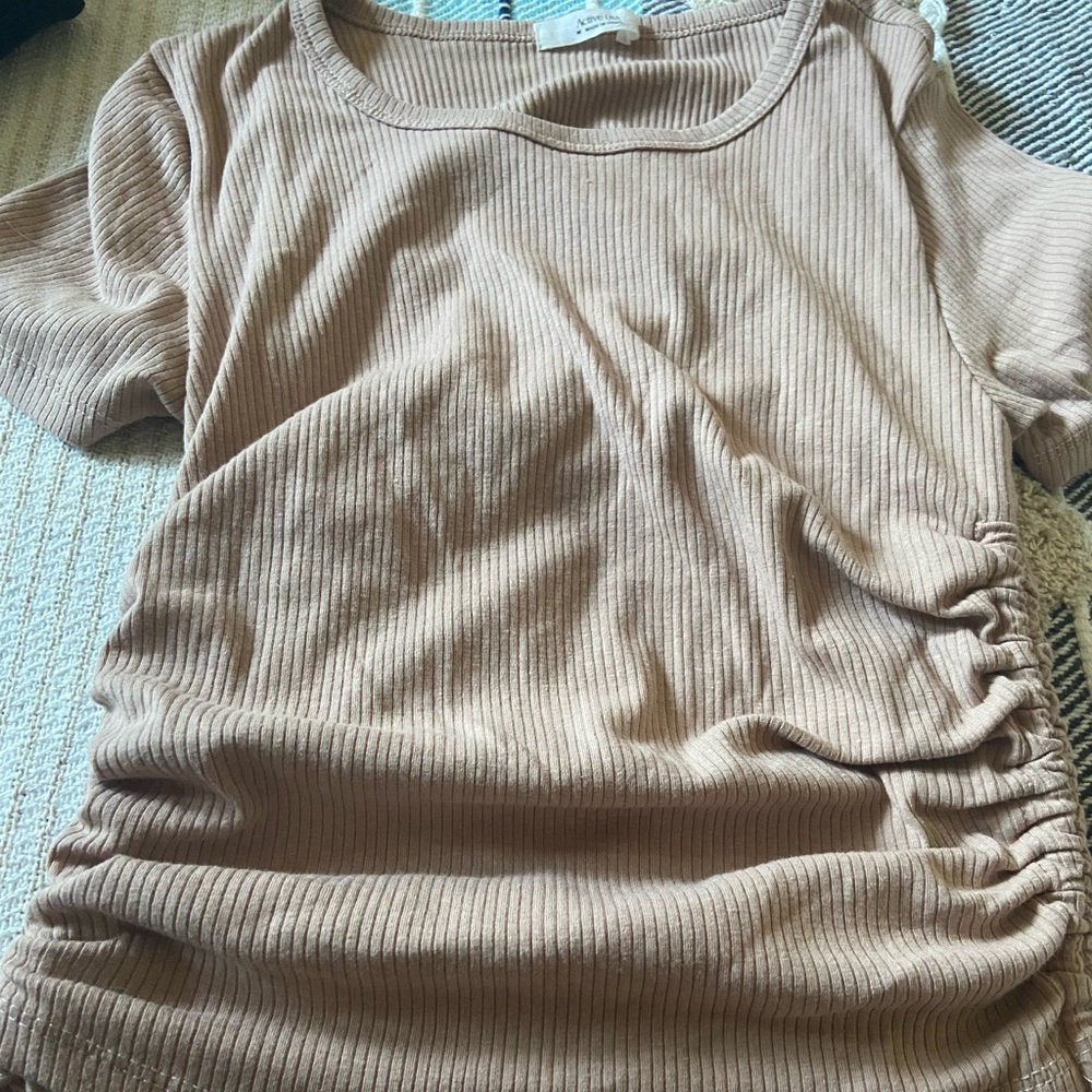 Cream blouse with strings on the side & you can stretch the shirt to your liking